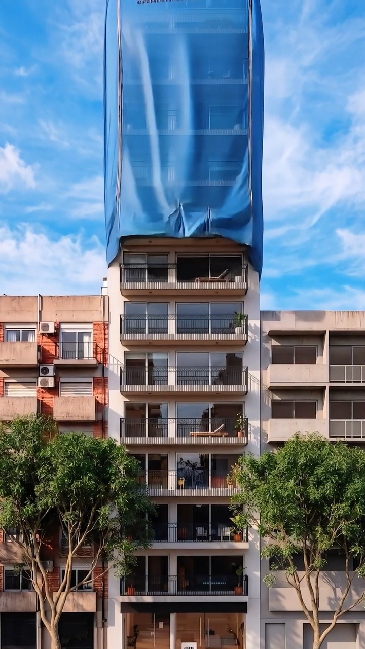 Lona que se levanta y descubre un edificio terminado